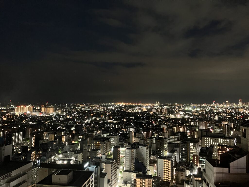 川崎新町、八丁畷、鶴見市場周辺と、奥に横浜ベイブリッジ(夜景)